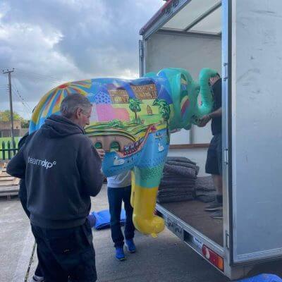 Warrens Removals team putting an elephant in their removals van for St Richards Hospice Worcesters Big Parade 2021