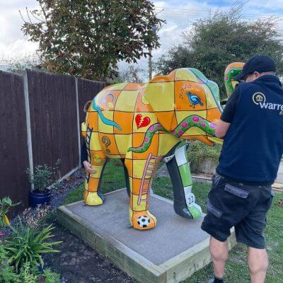 Warrens Removals team putting elephant on a plinth for St Richards Hospice Worcesters Big Parade 2021